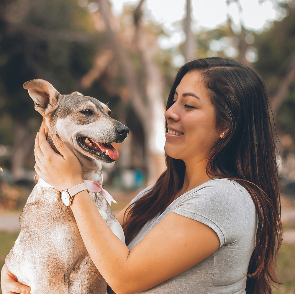 lady spending time with pet dog