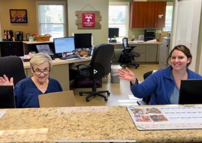 receptionists at the front desk of a vet clinic
